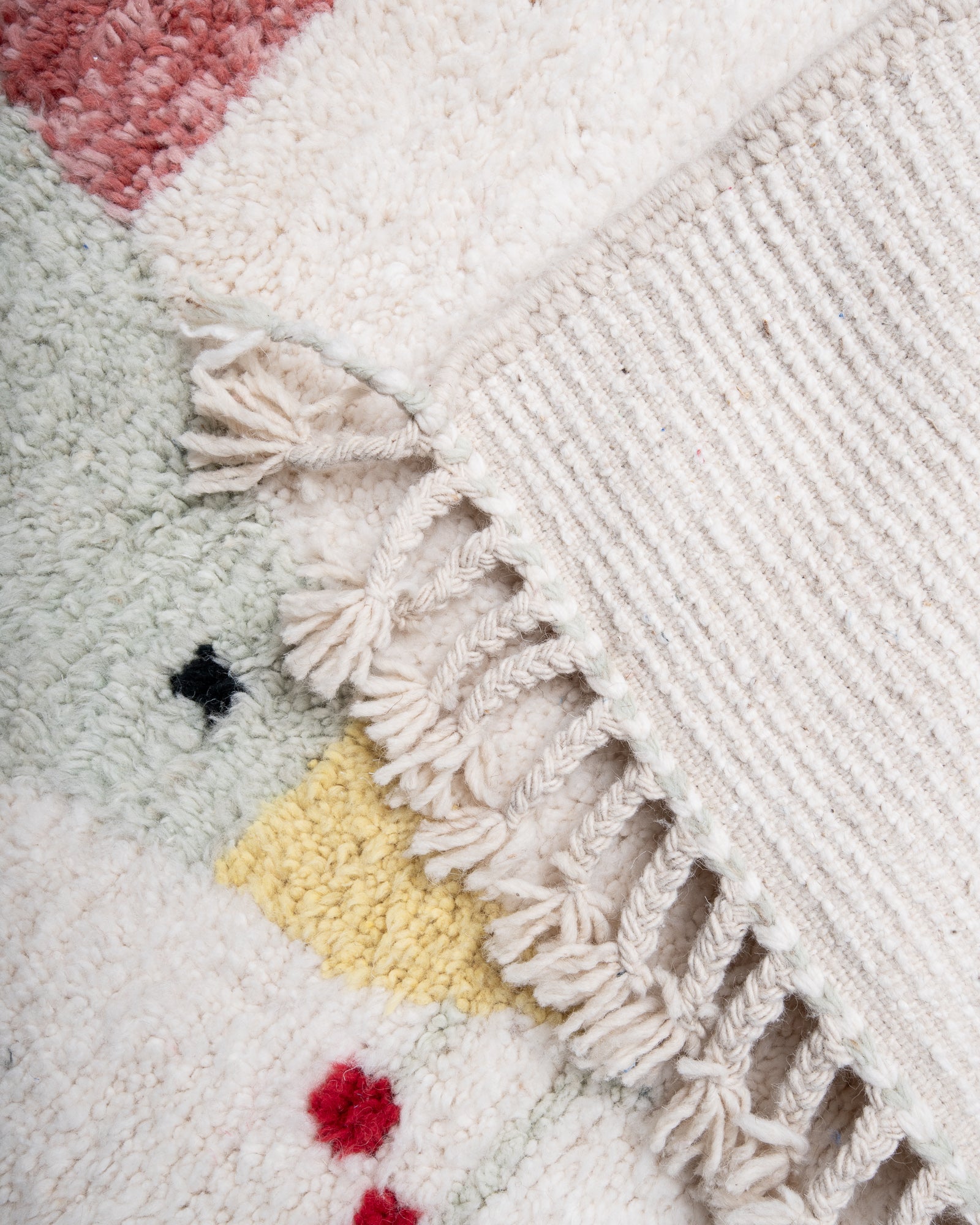Modern, designer, handcrafted Berber rug from Morocco. Beniourain carpet with beautiful colours and patterns and fluffy wool texture.